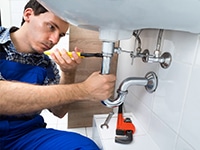 Plumbing repairing a sink