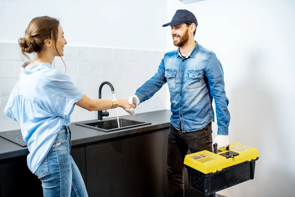 woman greets plumber
