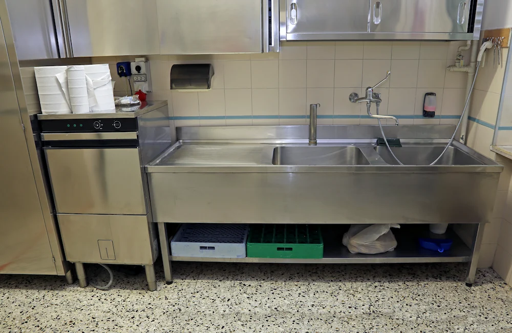 large stainless steel sink of industrial kitchen for preparing food